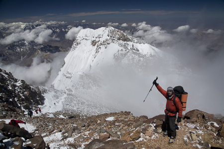 Click for full-size gallery. Ryan leading the way down, and you can see clouds starting to form behind him.