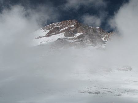 Click for full-size gallery. A glimpse of the mountain as it peeks out from under the clouds.